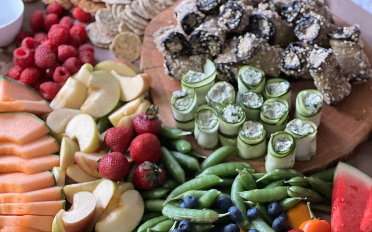 Colorful table of fruits, vegetables, and healthy snacks