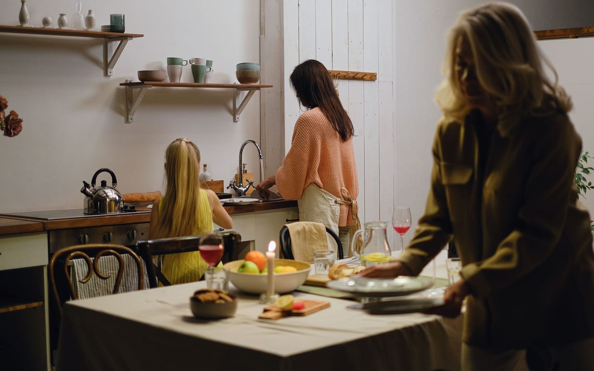 Family preparing food together at a kitchen table
